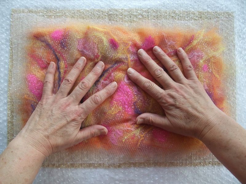 Applying soapy water to wool