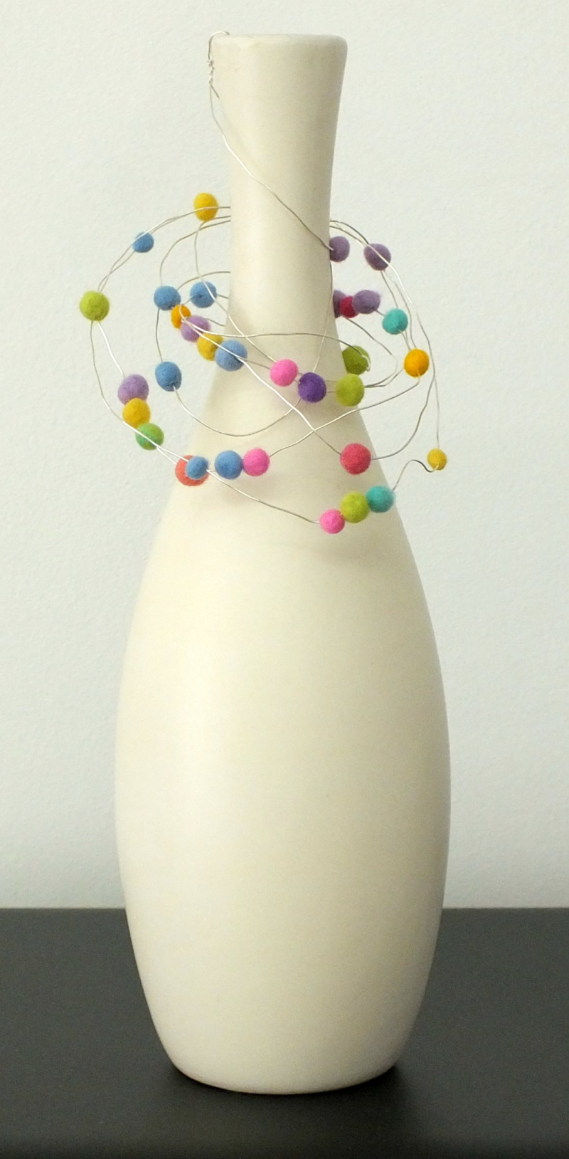 Tall vase with bead hanger