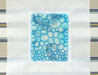 Felt stitched to thin poly cotton and placed on rectangle of mountboard Felt stitched to thin poly cotton and placed on rectangle of mountboard