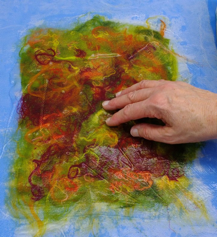Work the paste into the silk fibres with your fingers