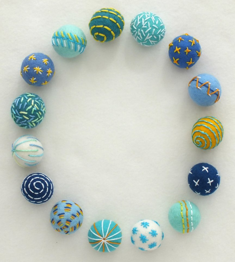 Embroidered felt beads