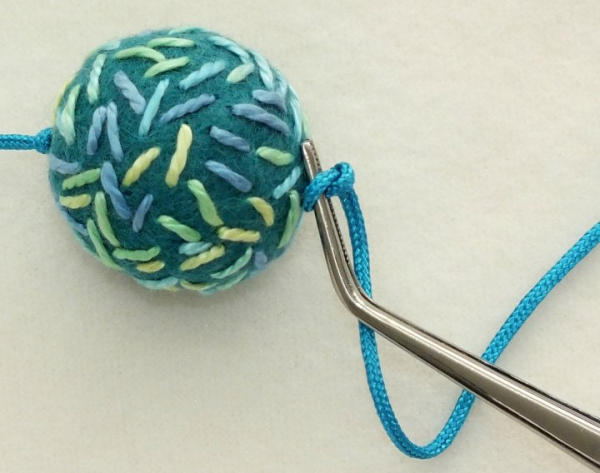 How to string felt beads, make a double sliding knot, and a few