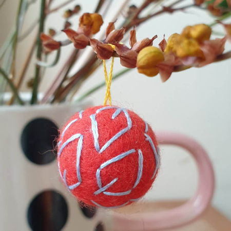 Orange felt bead up close